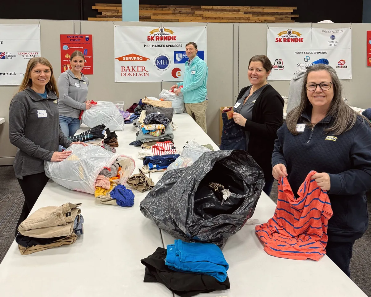 Bobbitt team sorting donations for a giving-back event